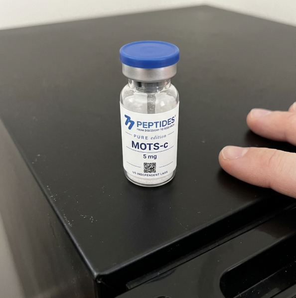 MOTS-c 5 mg vial on a dark surface